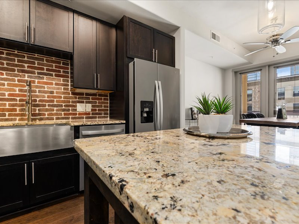 Kitchen with refrigerator and dining table